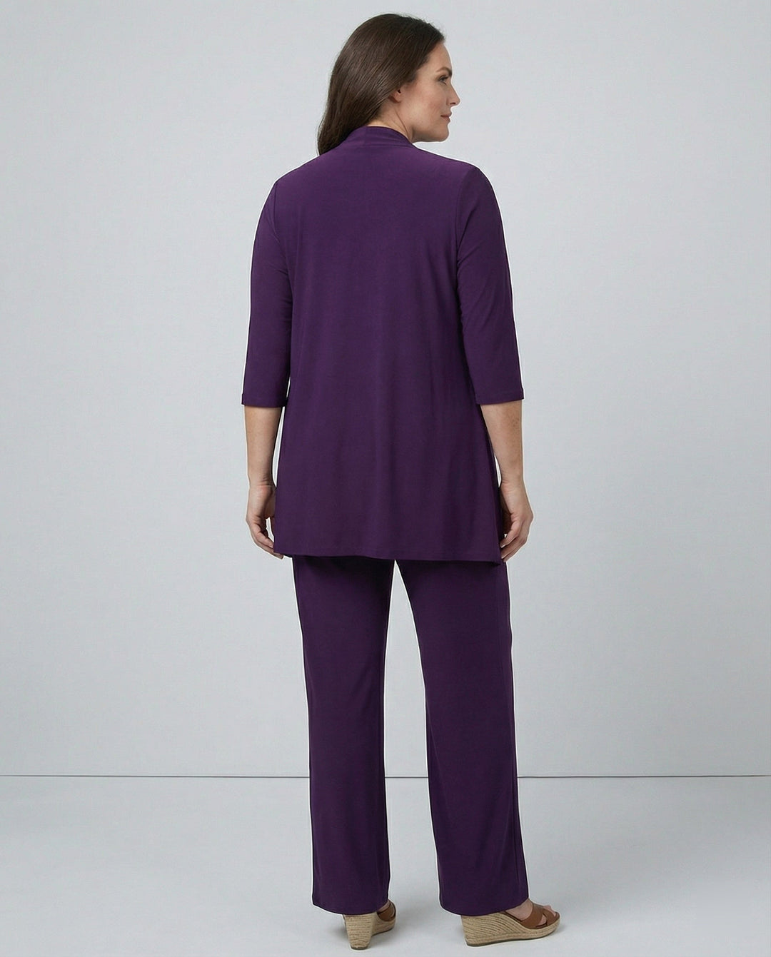 Stylish women's 3-piece pant suit for business casual or professional wear, featuring wide leg pants.