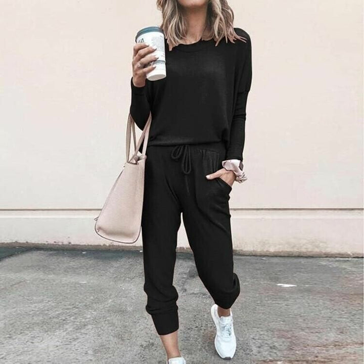 Relaxed fit women's two-piece matching lounge set with long sleeves, ideal for comfortable loungewear.
