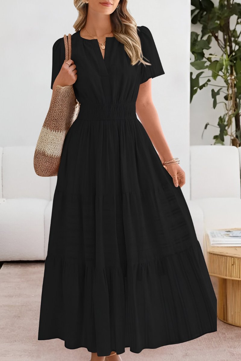 Flowy women's boho maxi dress featuring a tiered skirt and elegant flutter sleeves.