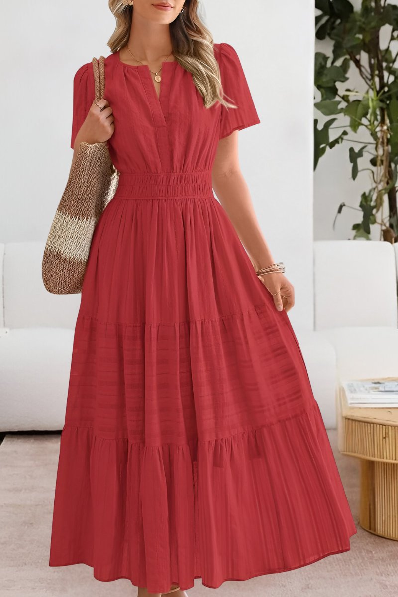 Graceful women's summer maxi dress with tiered skirt and delicate flutter sleeves.