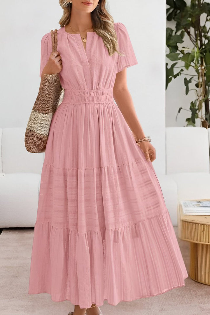 Elegant women's flowy maxi dress in boho style, featuring a beautiful tiered skirt design.