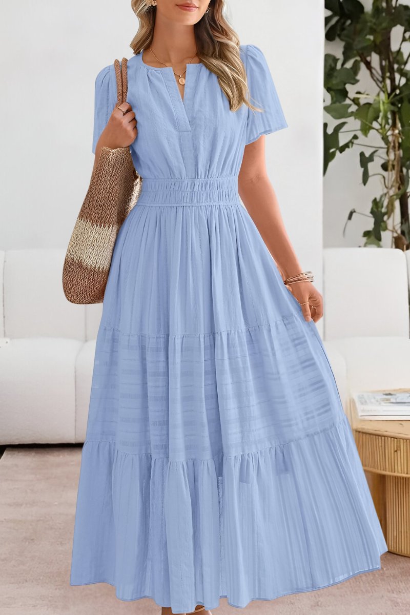 Long women's boho dress, a graceful tiered maxi style with airy flutter sleeves for summer.