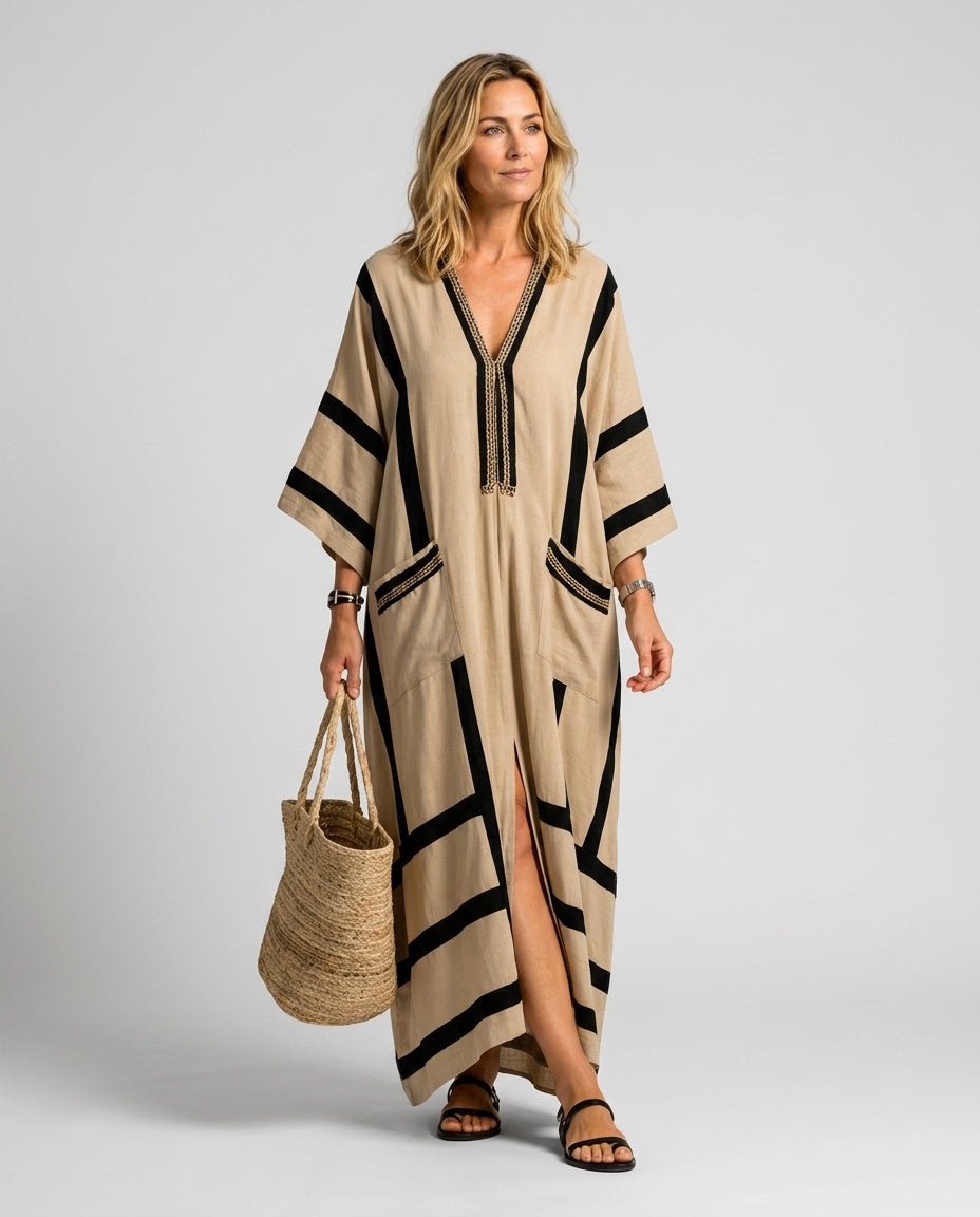 Women's refined striped trim V-neck kaftan beach dress, elegant loose-fit maxi for summer resort wear.