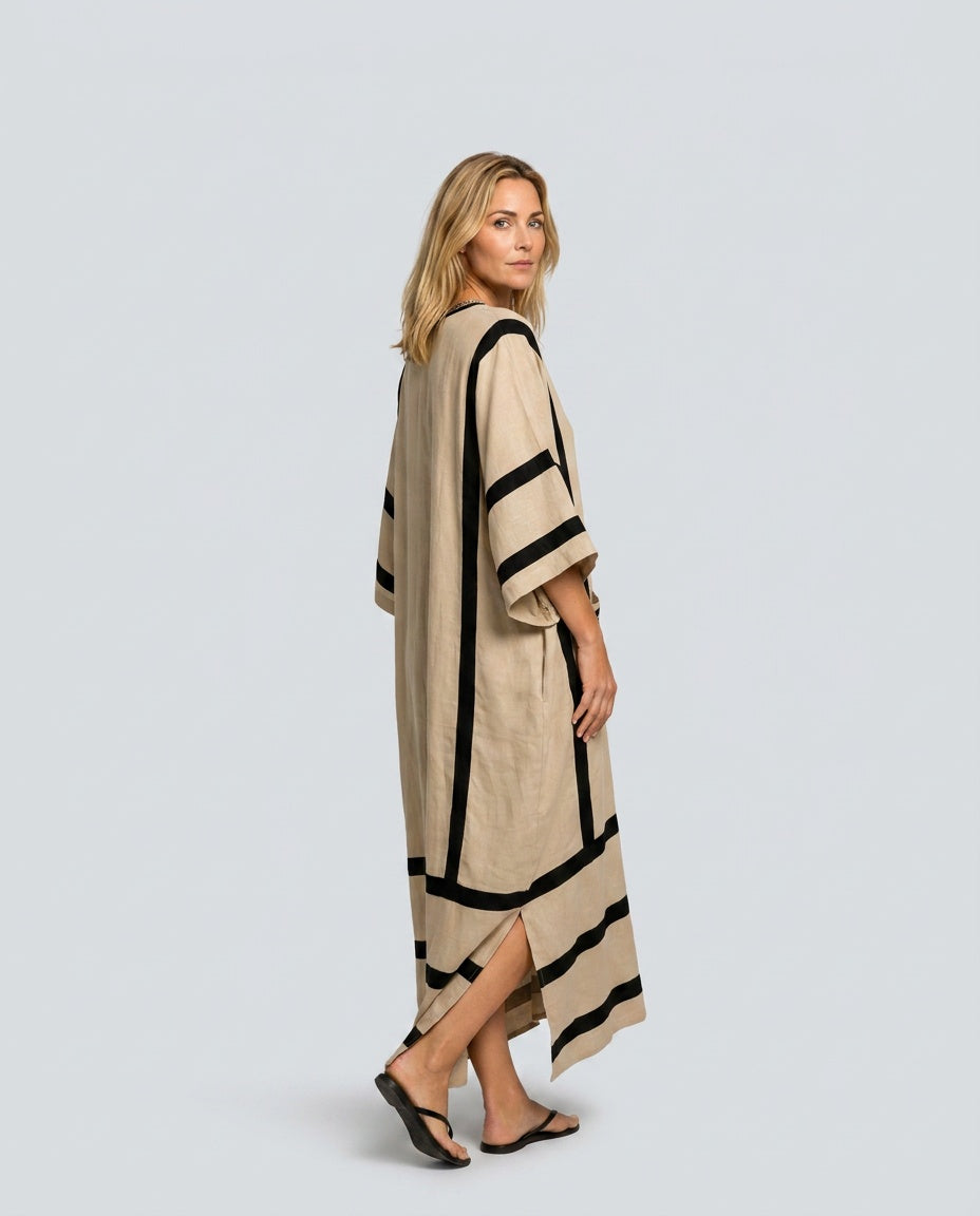 Flowy women's kaftan dress with striped trim & V-neck, perfect elegant maxi beachwear for vacation.