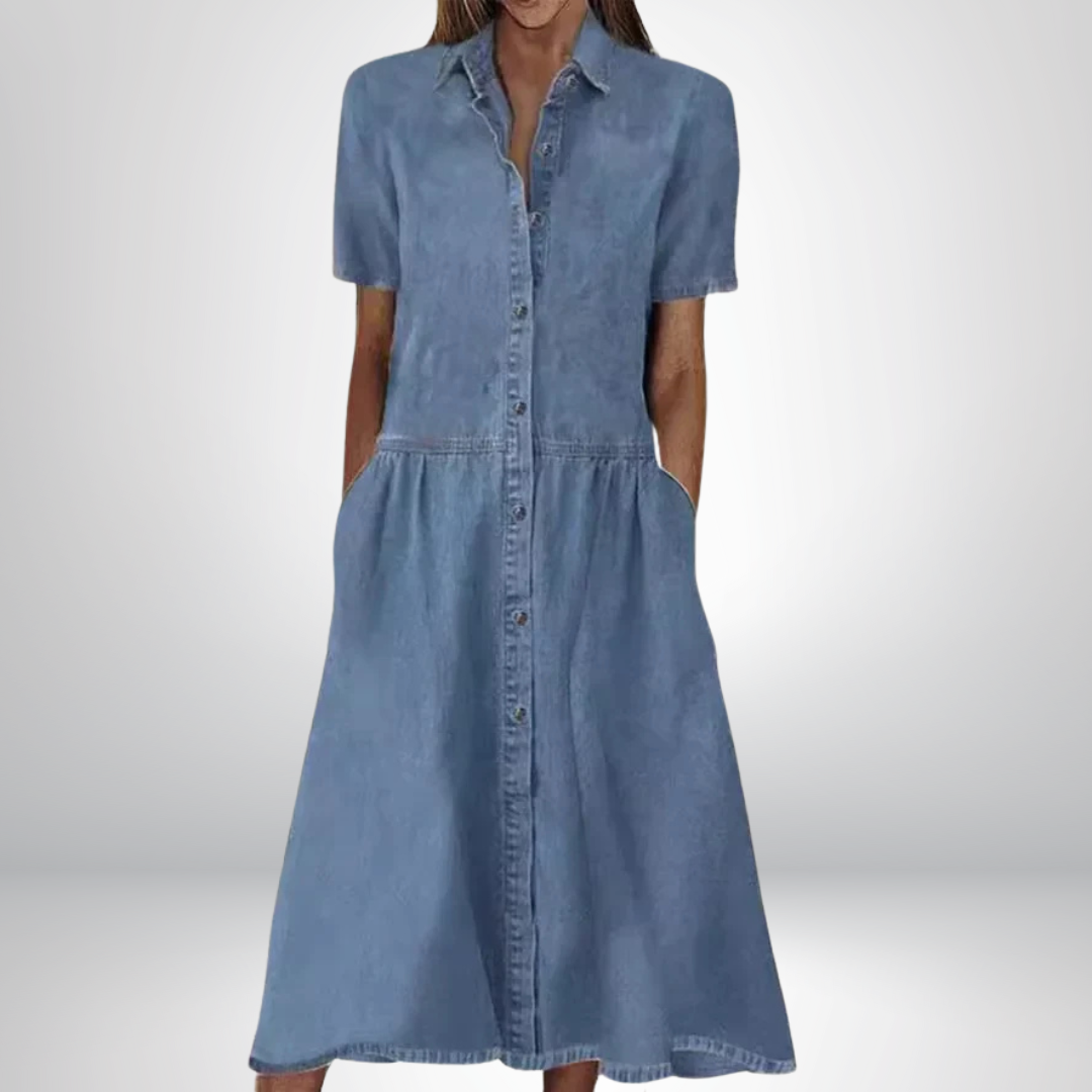 Women's blue A-line shirt dress with button front, short sleeves & pockets. Casual & versatile spring/summer style.