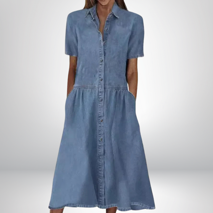 Women's blue A-line shirt dress with button front, short sleeves & pockets. Casual & versatile spring/summer style.