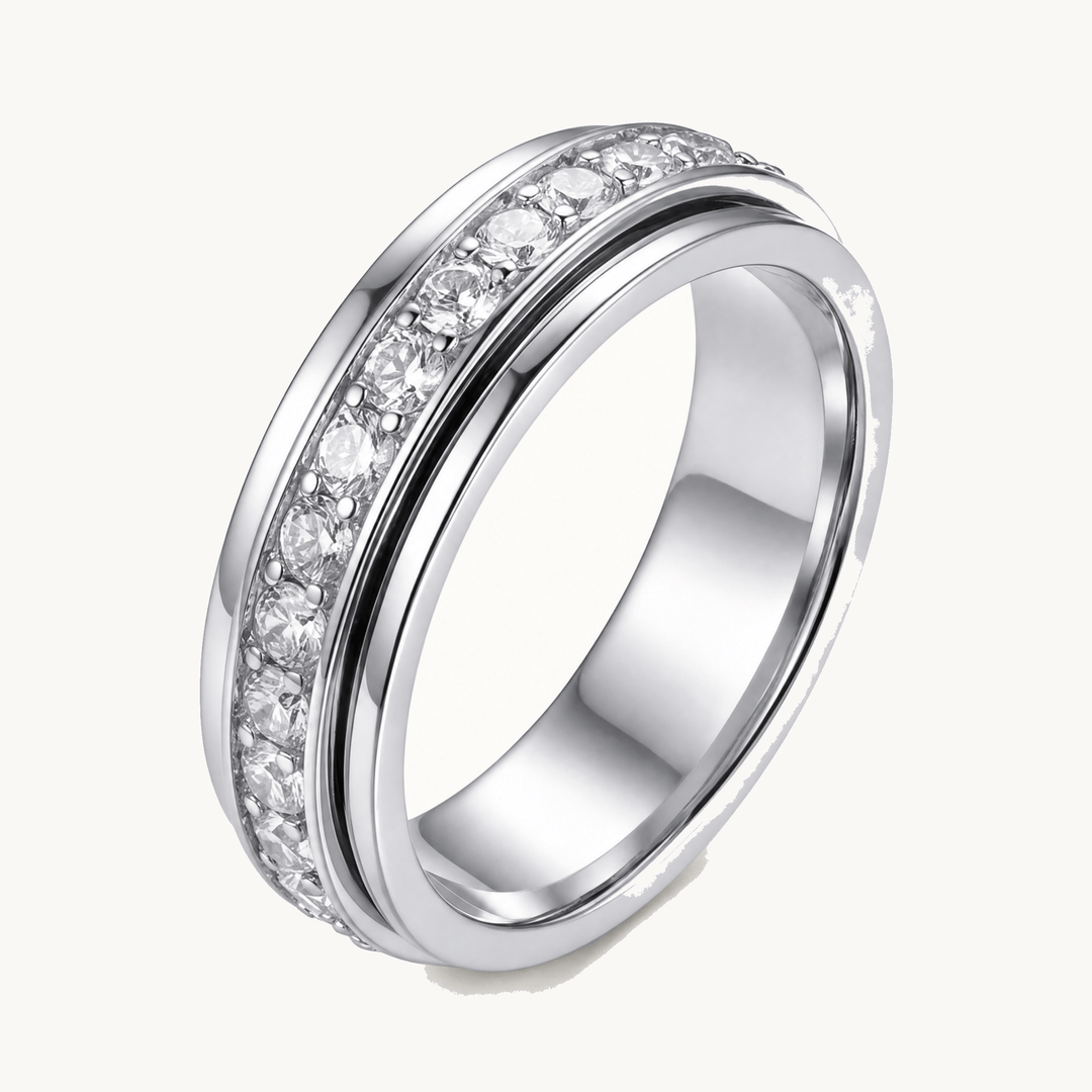 Women's sparkling zirconia spinner ring for anxiety relief, an elegant stress-reducing jewelry piece.