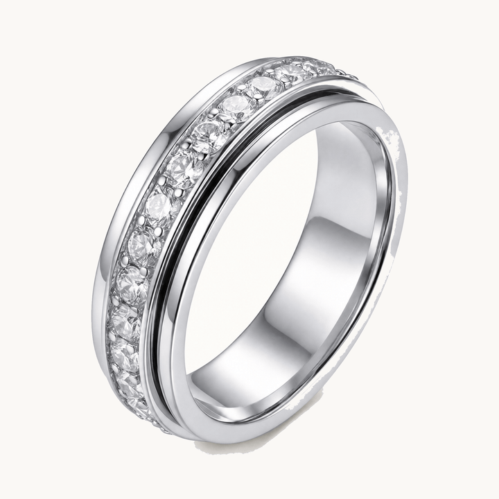 Women's sparkling zirconia spinner ring for anxiety relief, an elegant stress-reducing jewelry piece.