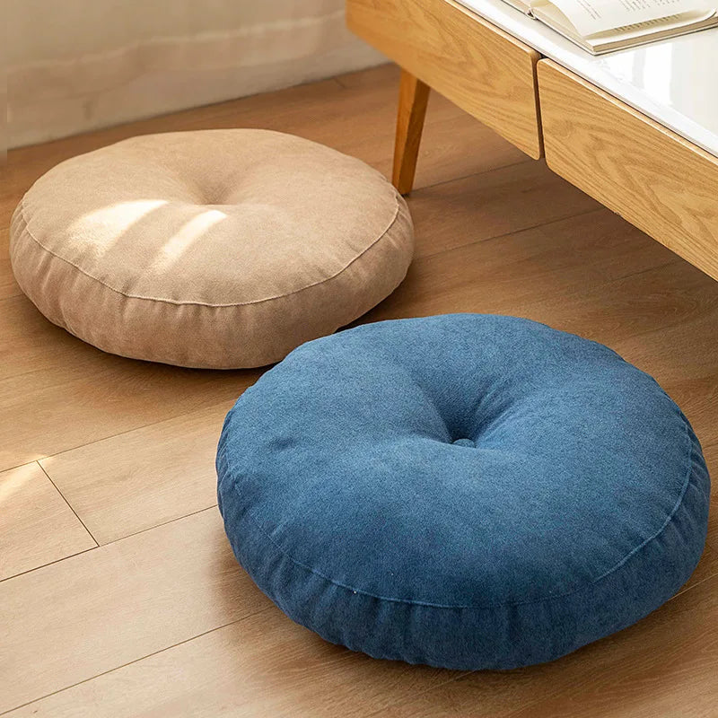 Supportive round yoga cushion for enhanced meditation and floor seating comfort.