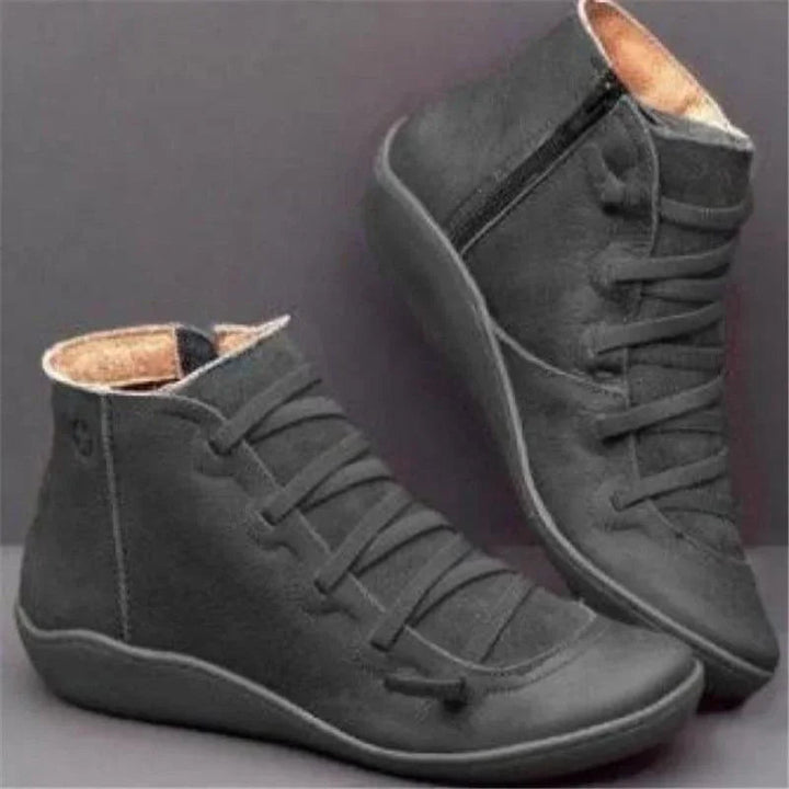 Winter style women's easy-zip ankle boots. Bunion relief, wide toe box comfort, durable walking boots.