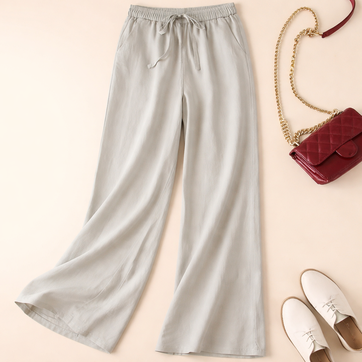 Model wearing stylish wide leg drawstring pants for women, showcasing a relaxed fit & comfortable everyday fashion.