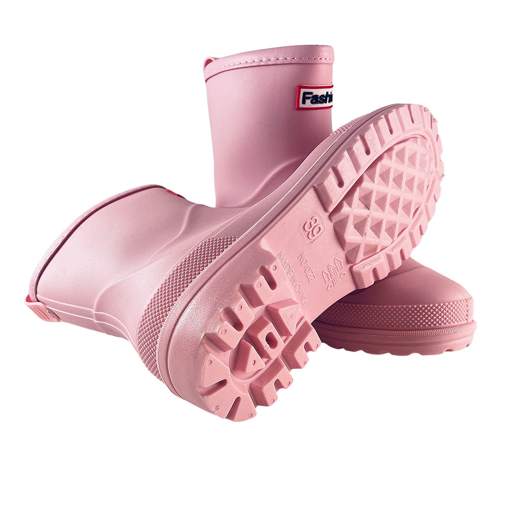 Black waterproof ankle rain boots for women, perfect for wet weather & muddy conditions.