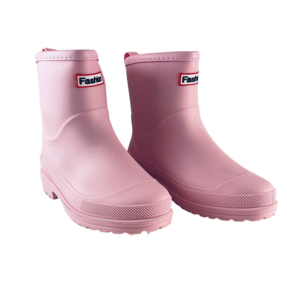 Stylish pink women's ankle rain boots, offering waterproof comfort and a fashionable look in wet weather.