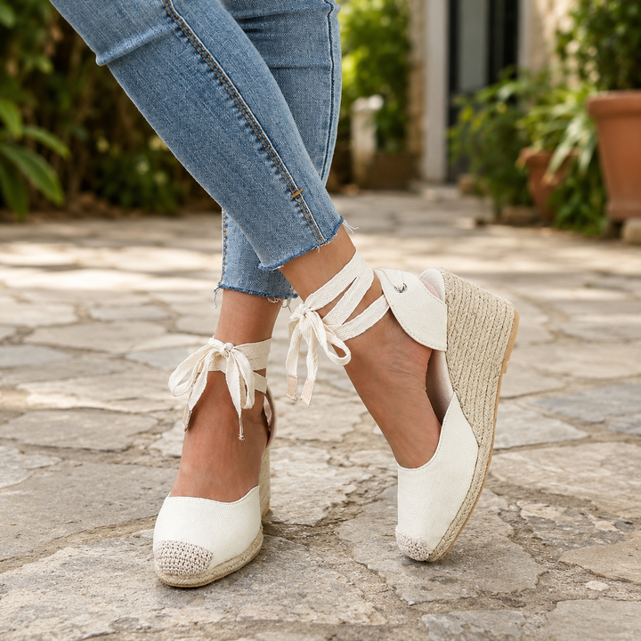 Women's stylish lace-up espadrille wedge sandals, perfect for summer fashion & comfortable holiday wear.