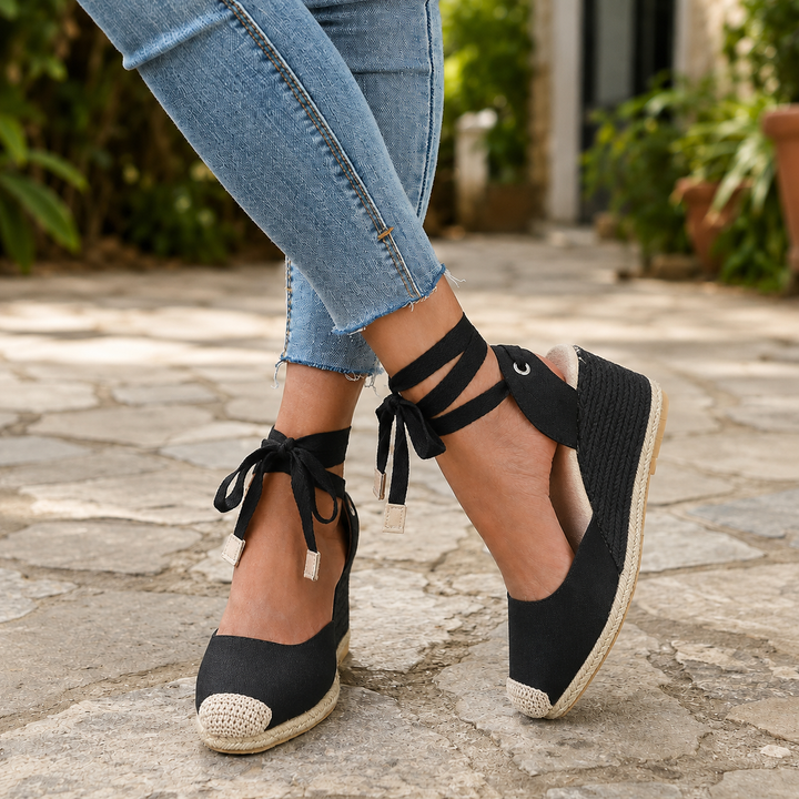 Chic women's espadrille wedge sandals with lace-up detail, ideal for summer, beach, or versatile fashion.