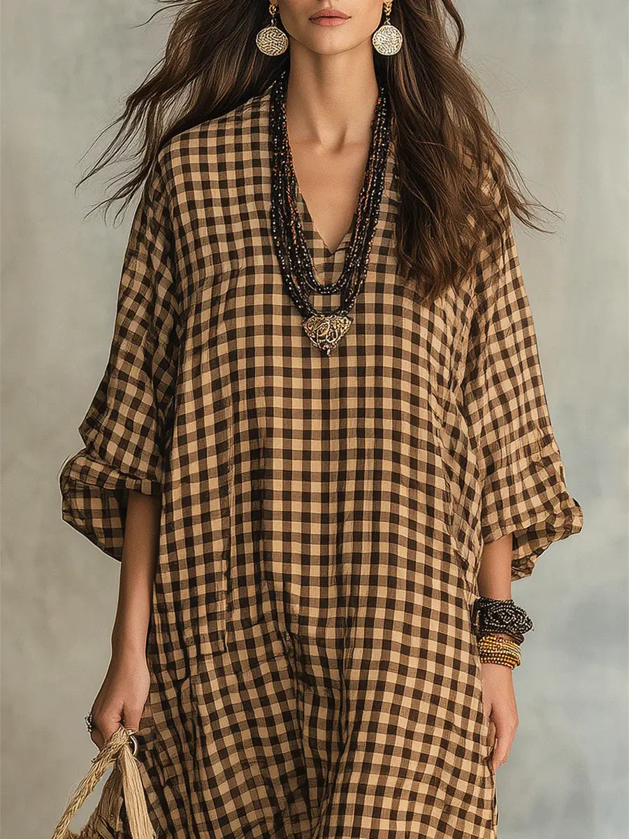 Oversized gingham maxi dress for women, featuring a flattering V-neck and comfortable long sleeves, ideal for casual style.