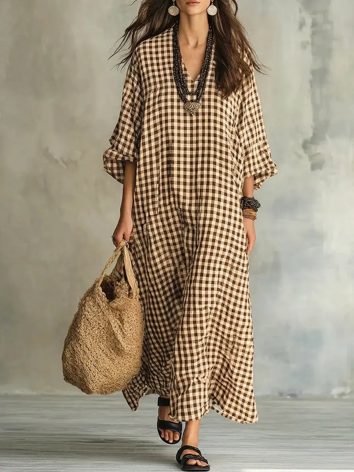 Elegant women's oversized gingham maxi dress with a flowy silhouette, perfect for a chic and comfortable everyday look.