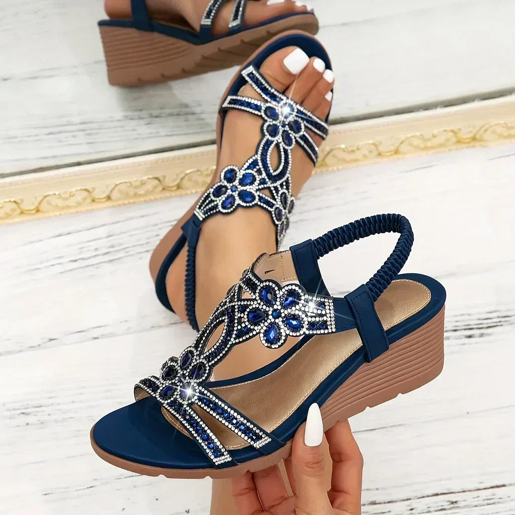 Women's relaxed platform wedge sandals with elegant crystal and floral embellishments for summer comfort.