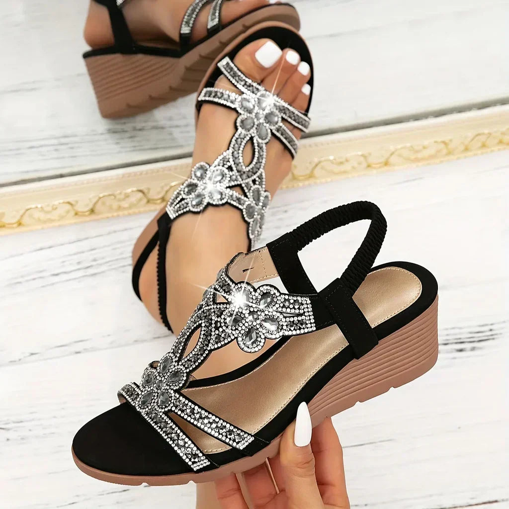 Embellished women's wedge platform sandals featuring sparkling crystals and delicate floral designs, perfect for casual elegance.