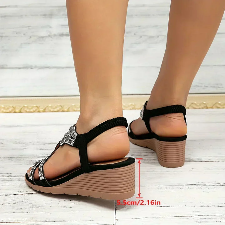 Elegant floral and crystal embellished women's platform wedge sandals, offering a blend of summer style and comfort.