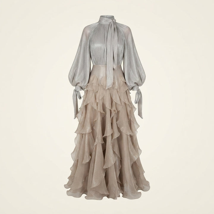 Apricot women's high-neck ruffled maxi dress. Ideal wedding guest or party wear with long sleeves and elegant flow.