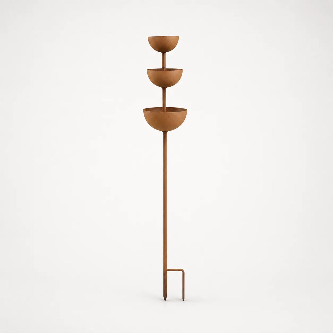 Decorative rustic copper finish bird bath stake, perfect for garden art.