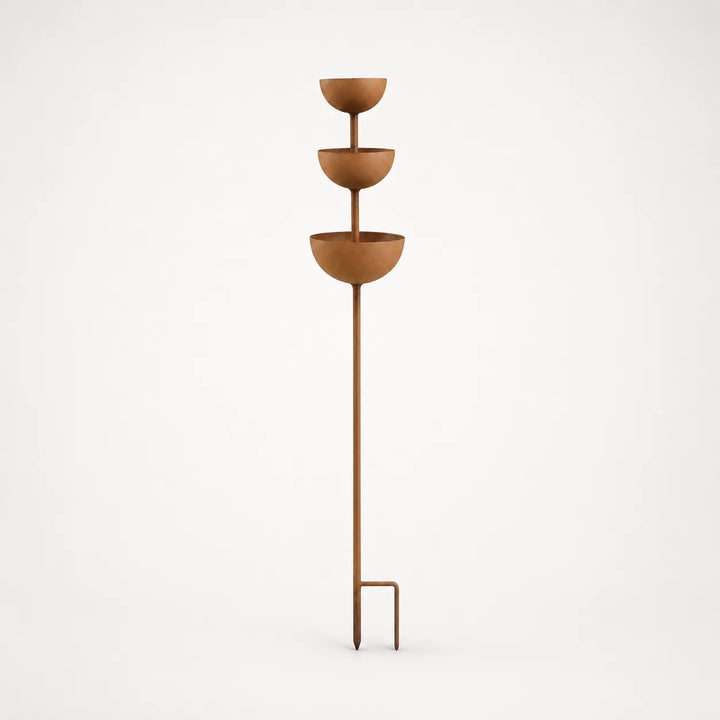 Decorative rustic copper finish bird bath stake, perfect for garden art.
