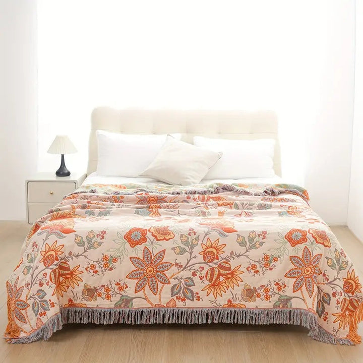 Bohemian chic floral cotton throw blanket with soft texture. Enhances rustic home decor & adds cozy charm.