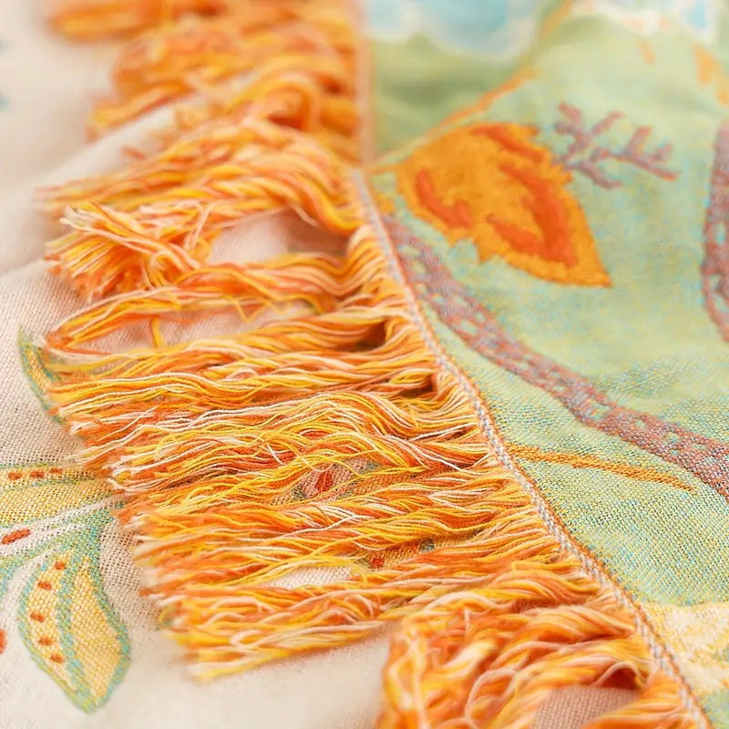Versatile decorative floral cotton throw blanket. A soft boho accent for living room, bedroom, or home decor.