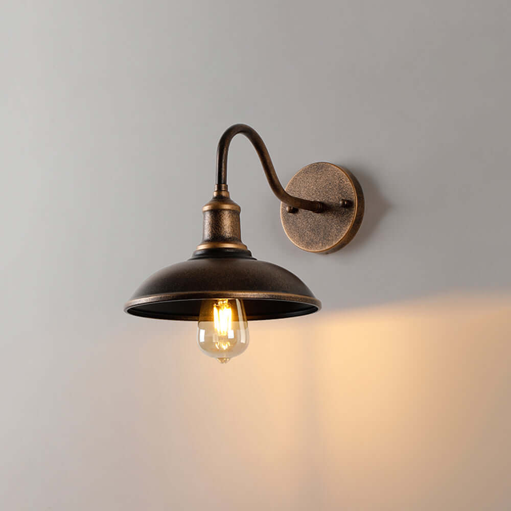 Rustic outdoor wall lamp in vintage antique brass style, perfect for exterior lighting.