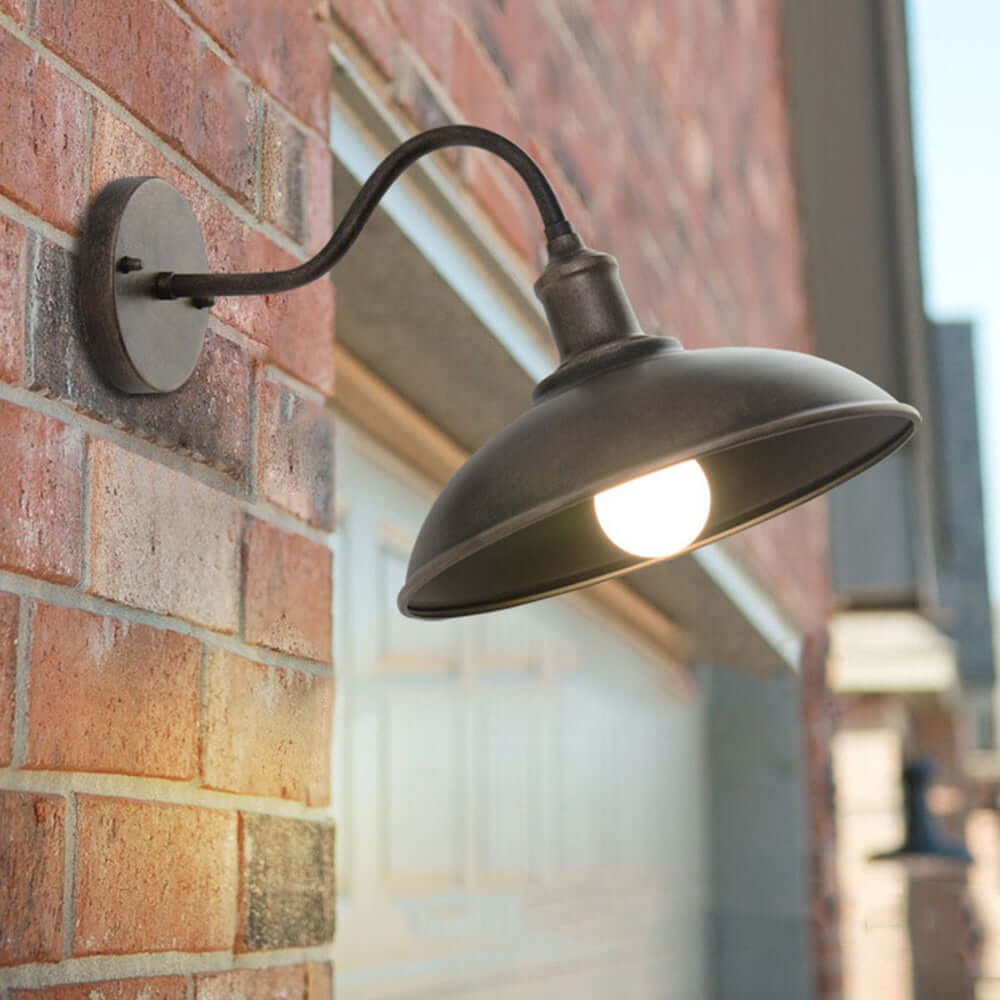 Vintage brass outdoor wall lamp for patio, garden, or rustic exterior decor.
