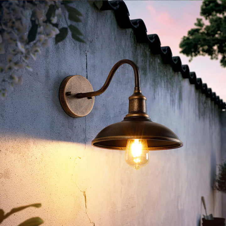 Waterproof rustic LED outdoor wall lamp with antique brass finish, ideal for garden lighting.