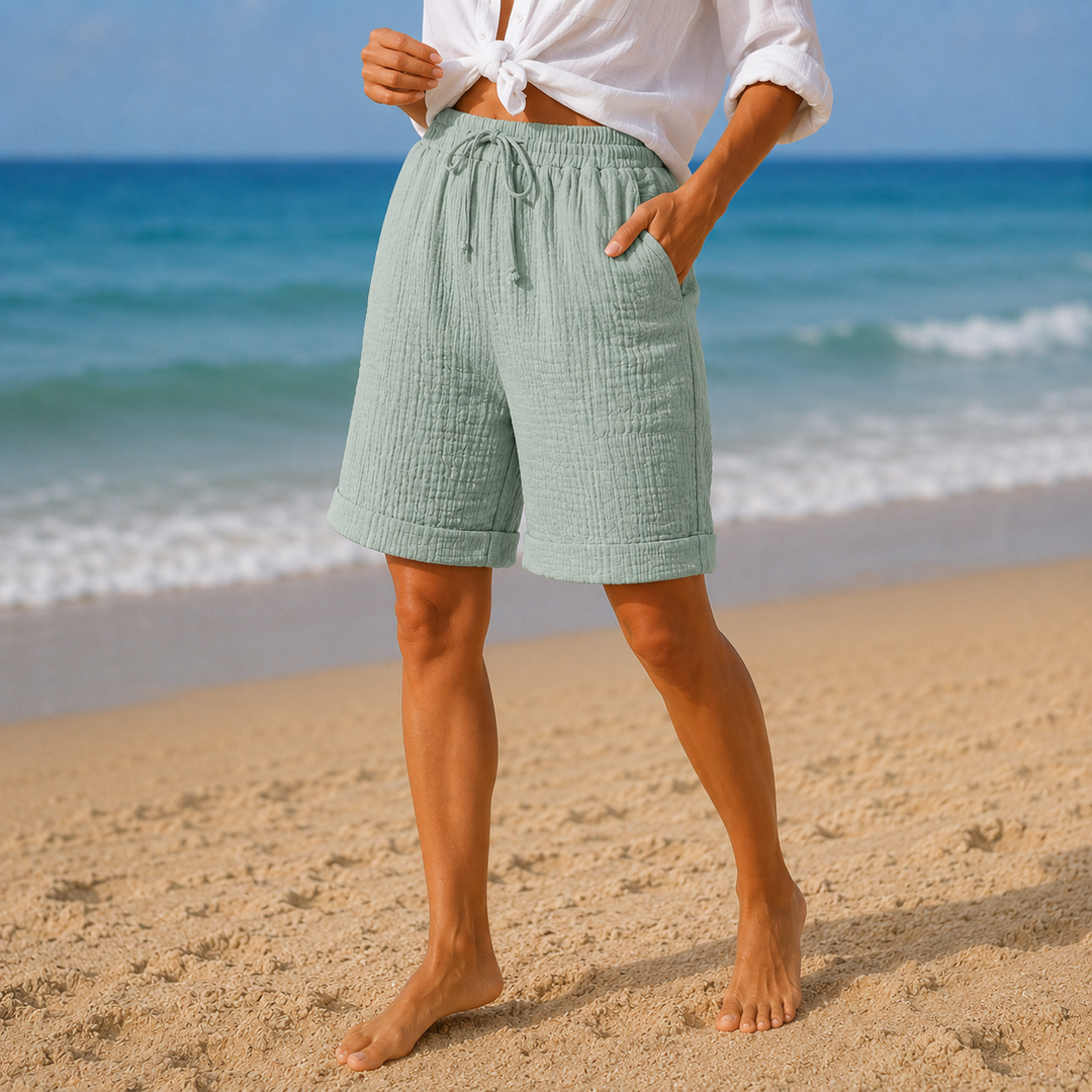 Women's relaxed fit crinkle Bermuda shorts, perfect casual wear for warm summer months.