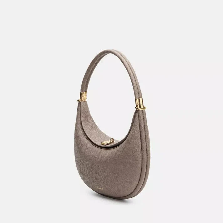 Elegant synthetic leather multi-strap women's handbag, perfect for versatile everyday use as shoulder or crossbody.