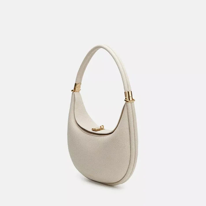 Sophisticated multi-strap women's handbag in synthetic leather. Chic crossbody or shoulder bag for versatile fashion.