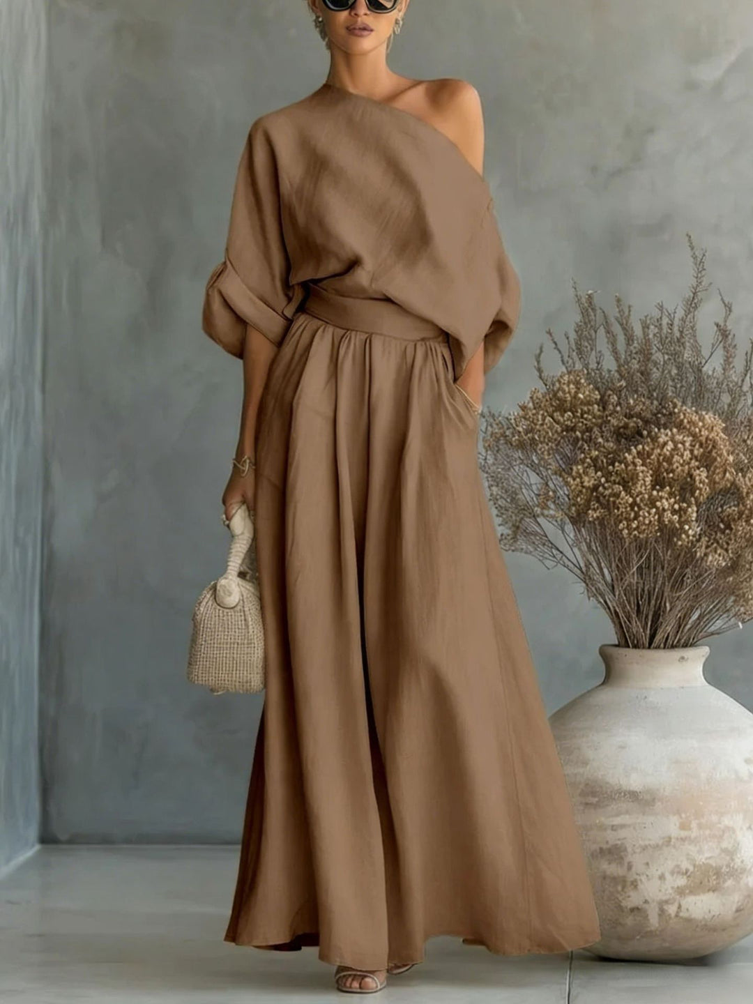 Chic women's one-shoulder maxi dress, versatile for elegant daytime or evening occasions.