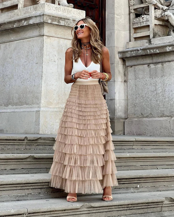 Women's flowy tiered ruffle midi skirt, perfect for elegant casual or party wear. Graceful summer fashion.