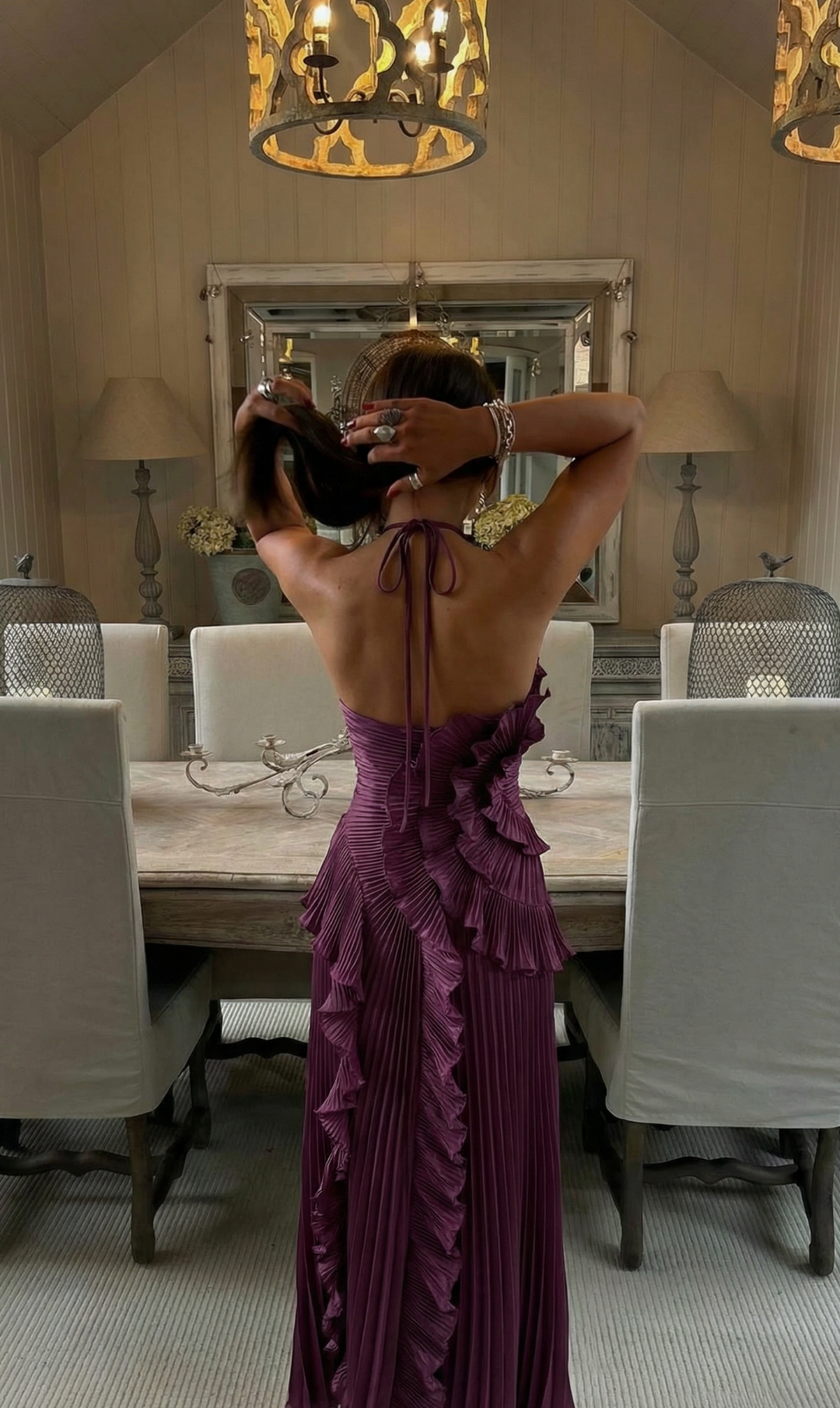 Formal women's special occasion dress, halter neck and cascading ruffles.