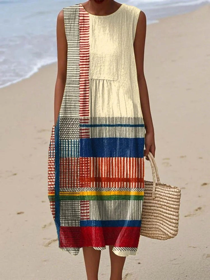 Elegant women's sleeveless midi dress, straight fit, showcasing a vibrant geometric art pattern. Ideal occasion wear.