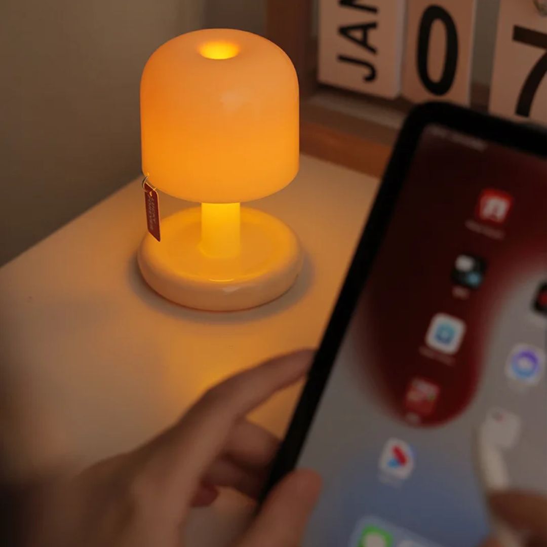 Small sunset lamp illuminating a bedroom, providing decorative, ambient LED mood lighting.