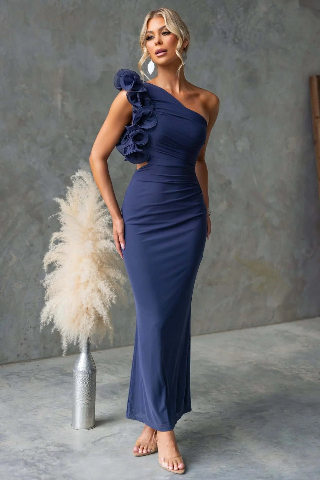 Elegant long dress for women, featuring a unique one-shoulder and flowing ruffle detail for events.