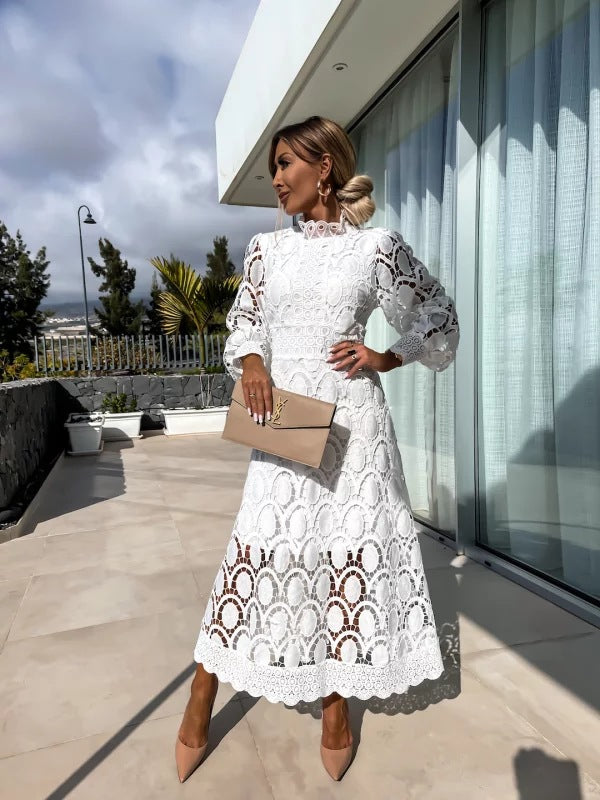 Women's midi cocktail dress with long sleeves, high neck, fitted waist & scalloped hem for formal wear.