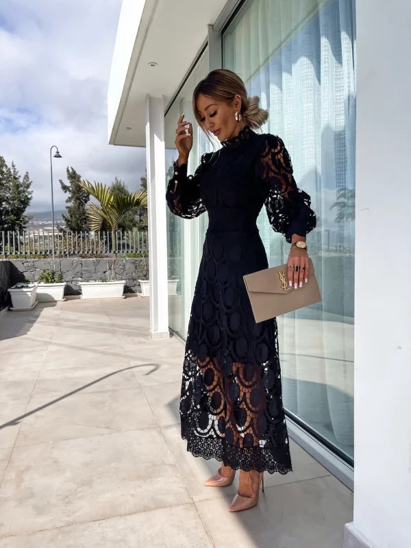Women's midi cocktail dress with intricate details, sophisticated design, perfect for elegant evening wear.
