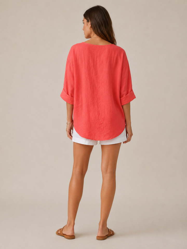 Essential women's 3/4 sleeve blouse, open collar, button front, offering elegant and relaxed fit.