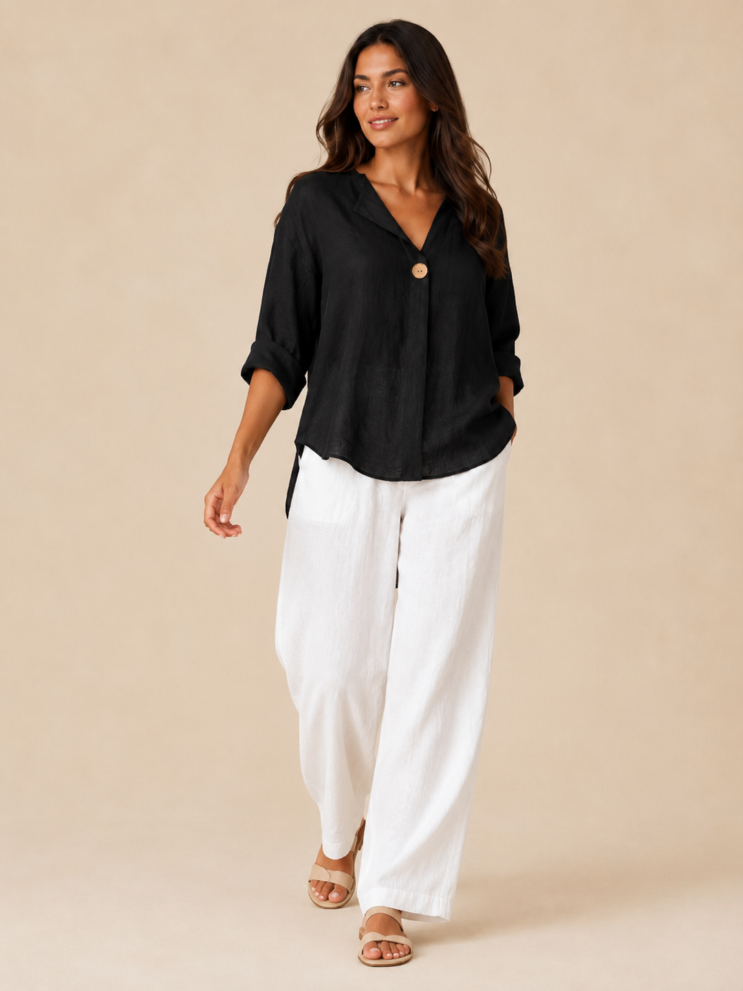 Model wears a women's 3/4 sleeve blouse, featuring an elegant open collar and relaxed fit for fashion.