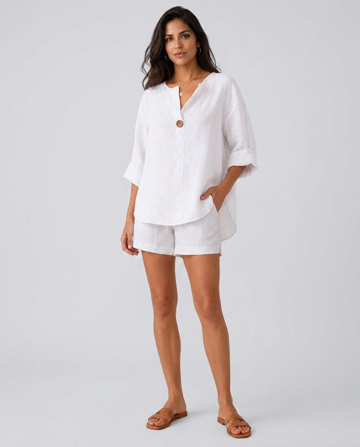 Detail of the elegant open collar and button front on a women's 3/4 sleeve relaxed fit blouse.