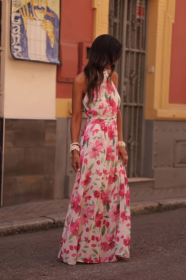 Flowing women's floral halter neck maxi dress, a delightful choice for beach holidays & warm weather.