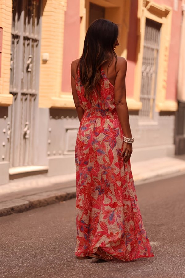 Vibrant floral pattern halter neck maxi dress for women, excellent for summer fashion & vacations.