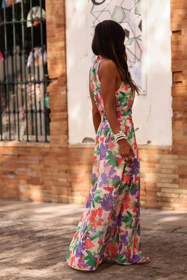 Women's elegant floral print halter neck maxi dress, a chic option for beach outings & summer events.