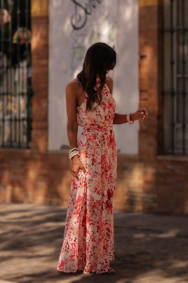 Women's beautiful floral print halter neck maxi dress, ideal as a stylish summer beach cover-up.